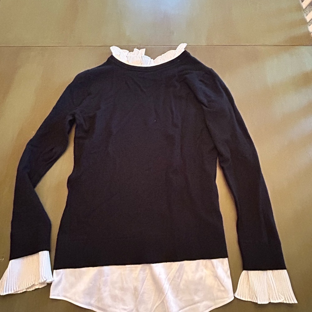 Stylish Black Top with White Ruffle Accents